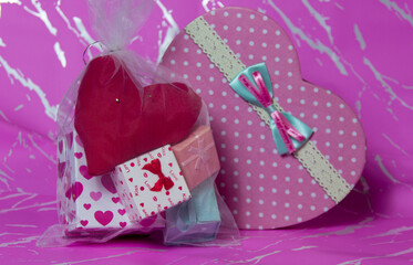 Valentine day composition: white gift boxes with bow and red hearts,Top View. and several different boxes and red heart