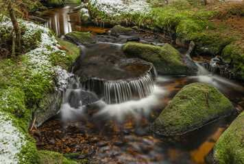 Konsky creek in National park Sumava with cascade and waterfall