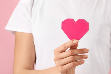 Woman with red heart, closeup