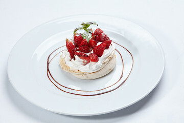 Strawberry pavlova cake on the white