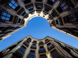 Foto auf Leinwand Street of Barcelona at the Gothic Quarter, barrio gotico, vertical axis low angle view,urban canyon © Frank