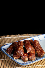 Chinese Sausages on a Blue and White Ceramic Plate