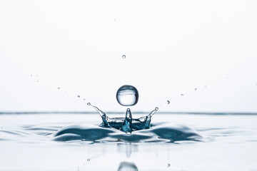 Freeze water liquid drop splash on pure background