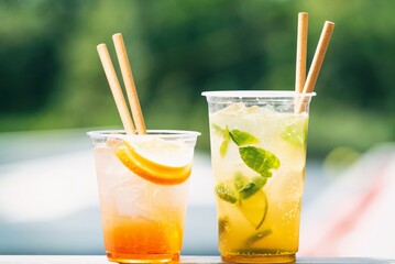 Cold ice beverage alcohol drink with fruits. Drikk with lemon and orange and ice.