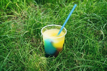 Granita semi-frozen dessert made from sugar, water and various flavorings. Granita on sun background