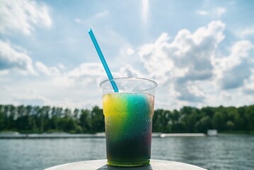 Granita semi-frozen dessert made from sugar, water and various flavorings. Granita on sun background