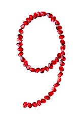 The font is composed of pomegranate seeds on a white isolated background. Number nine. Numbers from 1 to 9.