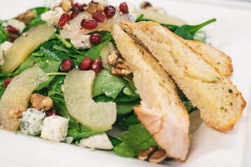Pear Salad with Dried Cherries, Candied Walnuts and gorgonzola cheese. Caramelized pear salad