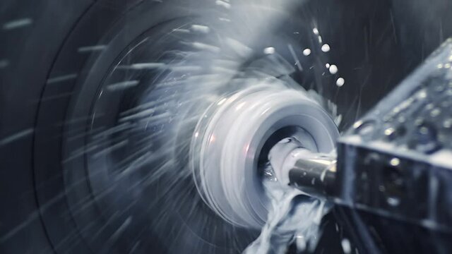 Slow motion. CNC Milling on sample work pieces. Cooling workpieces with water or atomization liquid through or spray nozzle. Oil circulating cooler for spindle
