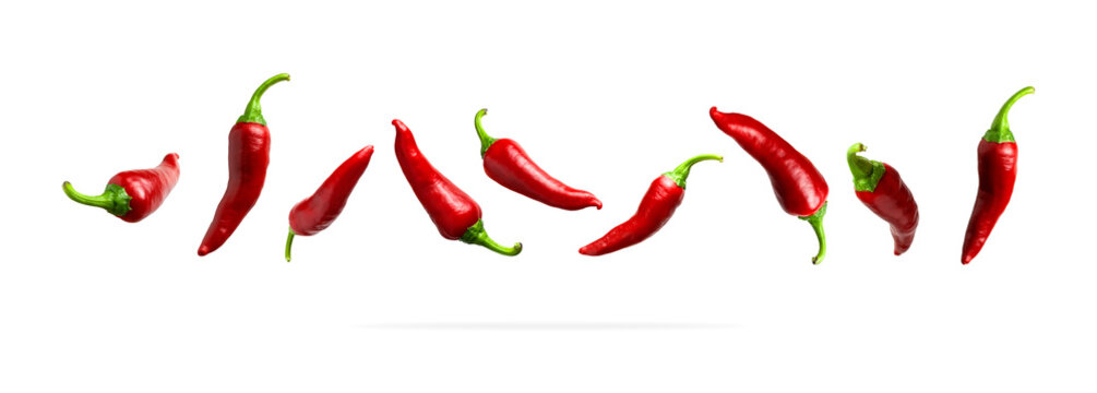Red fresh chili pepper isolated on white background. Seasoning for dish, hot pepper, spicy spices for cooking, cayenne pepper, food. Set of peppers of different shapes for your design