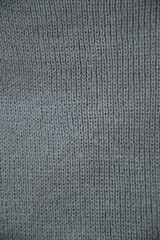 The texture of the knitted wool is gray.
