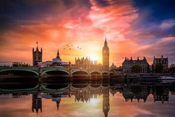 The Westminster Palace and the Big Ben clocktower by the Thames river in London, United Kingdom,...