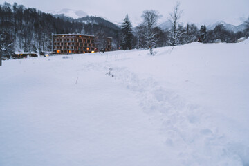 Fototapeta na wymiar Trail On The Snow In Ski Resort