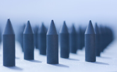metal sharp fences lined up on a blurry light background