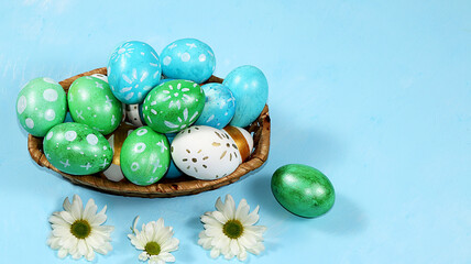 Happy Easter concept, spring greeting card, composition with decorated eggs on a delicate background. Minimal holiday concept, space for text, banner for screen, selective focus