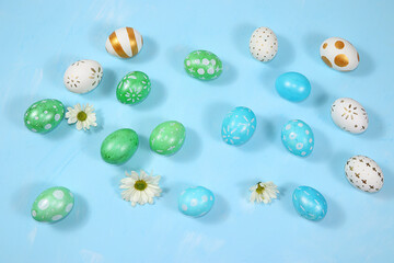 Happy Easter concept, spring greeting card, composition with decorated eggs on a delicate background. Minimal holiday concept, space for text, banner for screen, selective focus