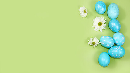 Happy Easter concept, spring greeting card, composition with blue decorated eggs on a delicate background. Minimal holiday concept, space for text, banner for screen, selective focus