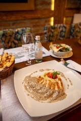 Chicken fillet with mashed potato and mushroom sauce