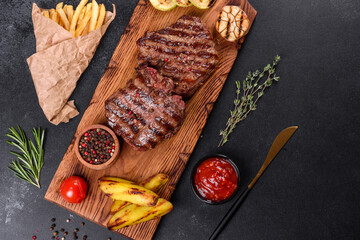 Fresh juicy delicious beef steak on a dark background