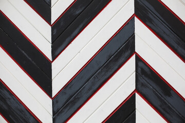 Geometrical design of wooden doors. Black and white stripes. Art background. Rustic gates.