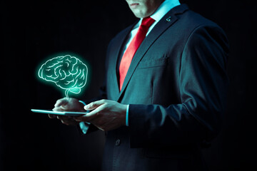 handsome businessman working with holographic technology