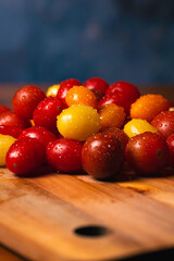 Assorted Cherry Tomatoes on Wood Cutting Board