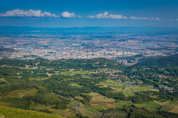View on Clermont Ferrand city from the top of the Puy de Dome, the most famous volcano of the Chaine des Puys, in Auvergne, France