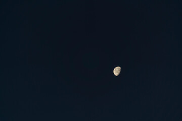 full moon over blue sky