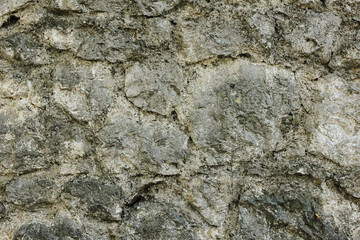 Naklejka premium Natural old beige stone wall textured background. Close up. Copy space.