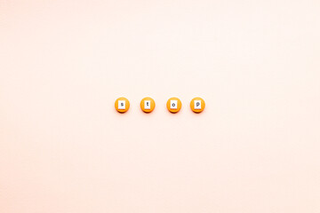 orange drugs with stop sign isolated over pink background. above view. outer space. stop medication...