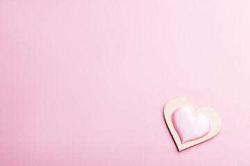 love and romance concept. heart shape isolated over pink background. above view. valentine greeting card. couple hearts conceptual