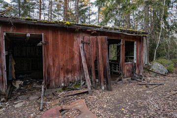 Abandoned hut on the car cemetery of Kyrkö Mosse in Sweden