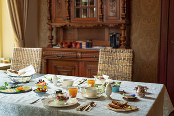table setting for a dinner with old furniture