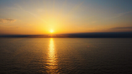Fototapeta na wymiar Perfect sunset on the opened sea