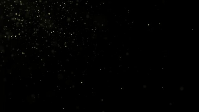 Abstract motion background shining gold particles. Gold glitter background with sparkle shine light confetti. Shimmering Glittering Particles With Bokeh. Seamless 4K loop video 3d animation