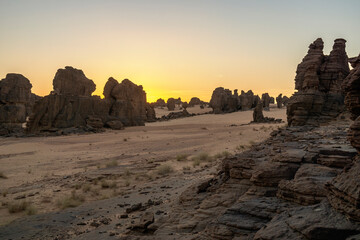 Sandstone pinnacles in the Sahara desert at sunset, Chad, Africa