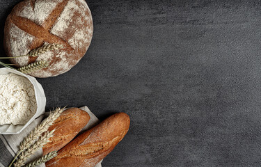 bread and flour on a plate.textured background.close up