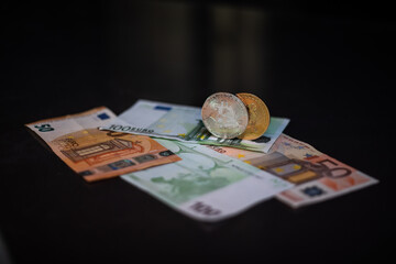 Cryptocurrency bitcoin. Money and bitcoin. Bitcoin is a close plan. Euro banknotes