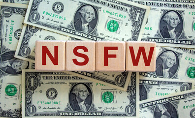 NSFW - not safe for work symbol. Wooden cubes with the word 'NSFW - not safe for work' on beautiful...