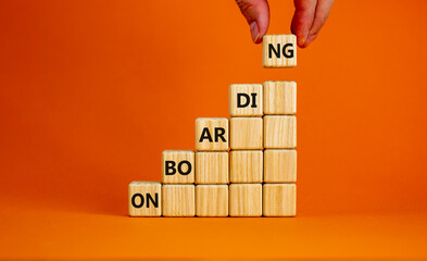 Success onboarding process symbol. Wooden cubes stacking as step stair on orange background, copy...