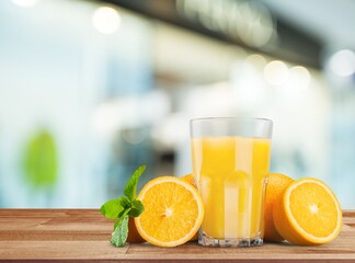 Orange juice and slices of orange on wooden desk © BillionPhotos.com