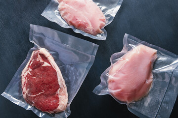Set of vacuum packed meats. Chicken breast and beef ribeye prepared under vacuum for cooking with...
