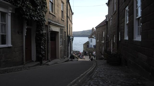King Street with harbour in background, Robin Hood's Bay, North Yorkshire, England, United Kingdom, Europe
