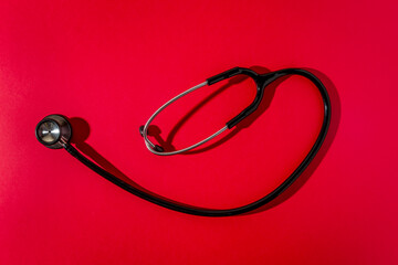 Stethoscope on a red background