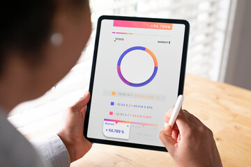 Woman working on a digital tablet in the new normal