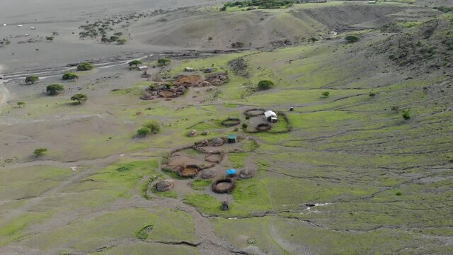aerial view on the maasai village in front of the ol doinyo lengai mou