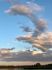 Fototapeta na wymiar Clouds in Blue sky acuponcture the sea