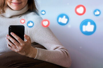 Woman smiling receiving likes from social media audience