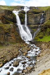 Obraz premium The view of the Rjukandafoss, a beautiful waterfall off Route 1 near Jokuldalur, Iceland during the summer