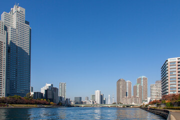 Fototapeta na wymiar Tokyo Cityscape and the Sumida River against the Blue Sky